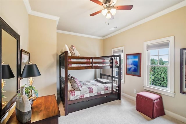 carpeted bedroom featuring baseboards, ornamental molding, and visible vents