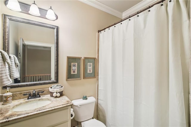 bathroom featuring toilet, crown molding, and vanity