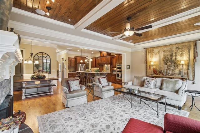 living room featuring a fireplace, crown molding, light wood-style floors, wood ceiling, and ceiling fan with notable chandelier