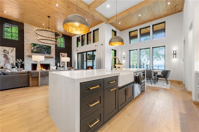 146 Overlook Way, Blue Ridge, GA 30513 - kitchen featuring a sink, wood ceiling with exposed beams, a high ceiling, light wood finished floors, and dishwasher