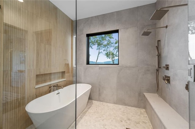 146 Overlook Way, Blue Ridge, GA 30513 - bathroom featuring walk in shower, a soaking tub, and tile walls