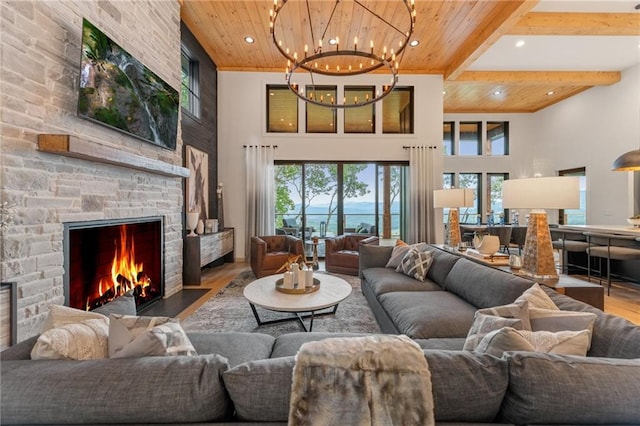 146 Overlook Way, Blue Ridge, GA 30513 - living area featuring wood ceiling with exposed beams, wood finished floors, a chandelier, plenty of natural light, and a towering ceiling