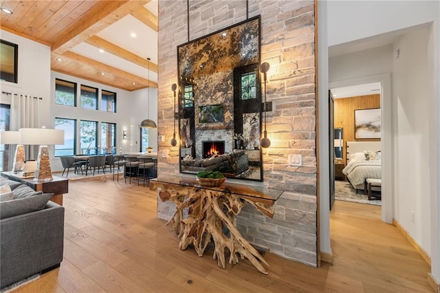 146 Overlook Way, Blue Ridge, GA 30513 - living room featuring a fireplace, hardwood / wood-style floors, beamed ceiling, recessed lighting, and a towering ceiling