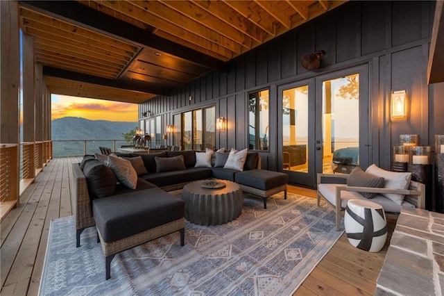 146 Overlook Way, Blue Ridge, GA 30513 - deck at dusk with an outdoor hangout area and a mountain view