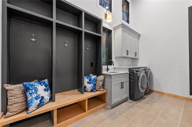 146 Overlook Way, Blue Ridge, GA 30513 - laundry area featuring washing machine and clothes dryer, cabinet space, baseboards, and light tile patterned floors