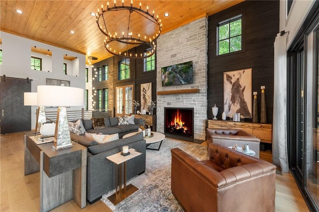 146 Overlook Way, Blue Ridge, GA 30513 - living area with wood ceiling, a high ceiling, wood finished floors, a stone fireplace, and recessed lighting