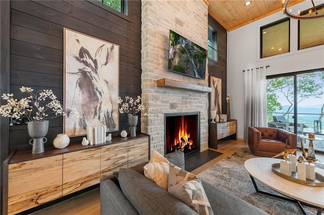 146 Overlook Way, Blue Ridge, GA 30513 - living room with wooden ceiling, high vaulted ceiling, wood finished floors, a stone fireplace, and wood walls