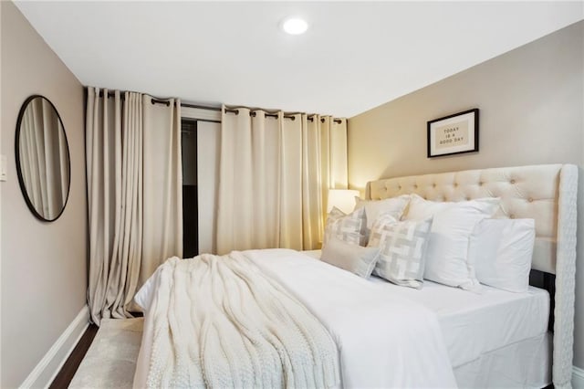 bedroom with hardwood / wood-style flooring