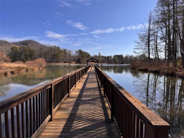 dock area with a water view and a gazebo