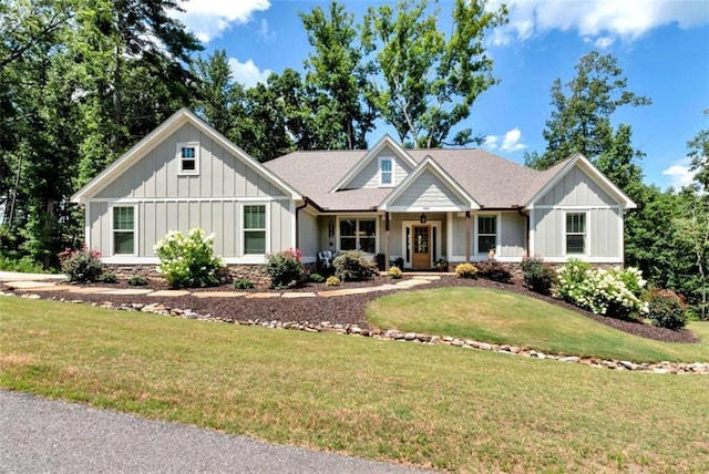 view of front of house featuring a front lawn and covered porch