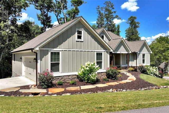 view of front of property with a garage and a front yard