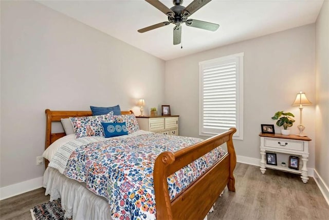 bedroom featuring hardwood / wood-style flooring and ceiling fan