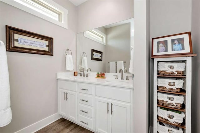 bathroom with vanity and hardwood / wood-style floors