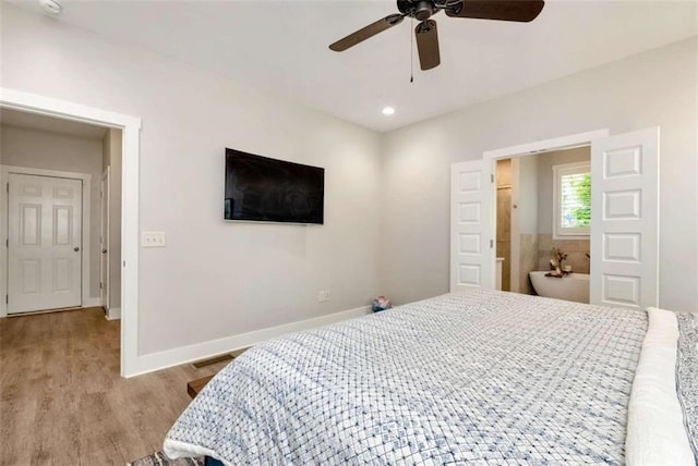 bedroom featuring ceiling fan and light hardwood / wood-style flooring