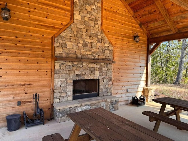 view of patio / terrace with an outdoor stone fireplace