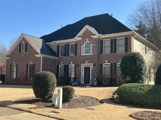 view of front of property featuring brick siding