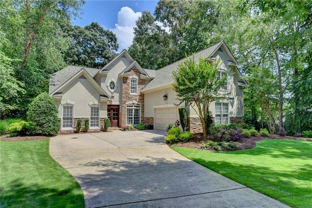 view of front of house with a garage, stucco siding, driveway, and stone siding