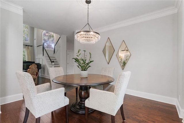 dining space featuring crown molding, a chandelier, stairs, baseboards, and wood finished floors