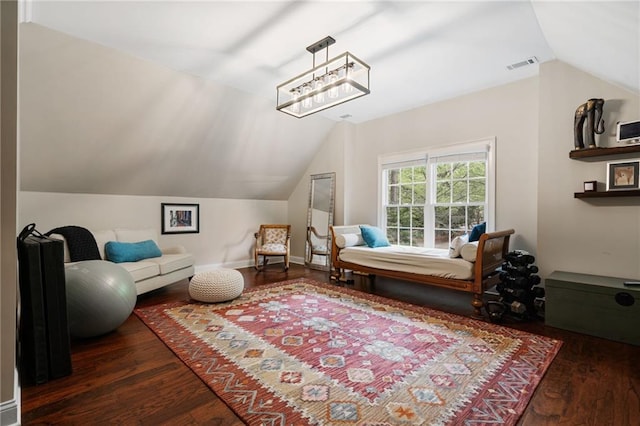 bedroom featuring visible vents, wood finished floors, and lofted ceiling