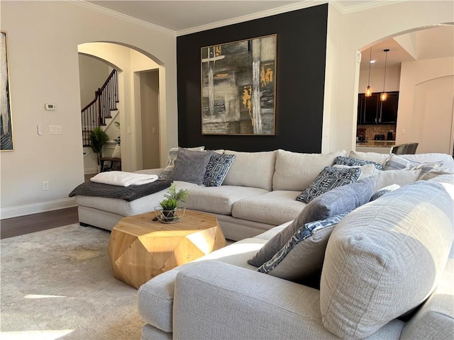 living room with hardwood / wood-style floors and crown molding