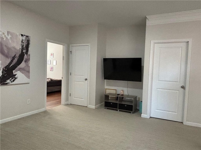 unfurnished bedroom featuring light colored carpet