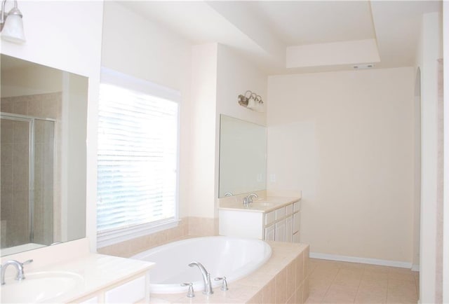 bathroom featuring tile patterned flooring, vanity, and separate shower and tub