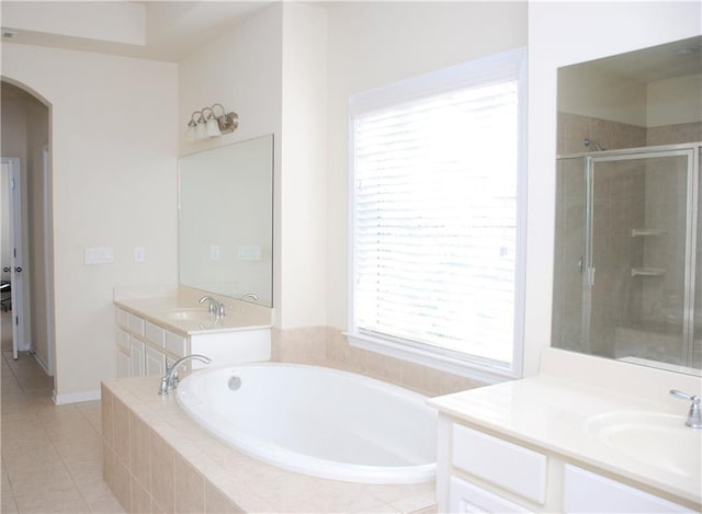 bathroom with vanity, shower with separate bathtub, and tile patterned flooring