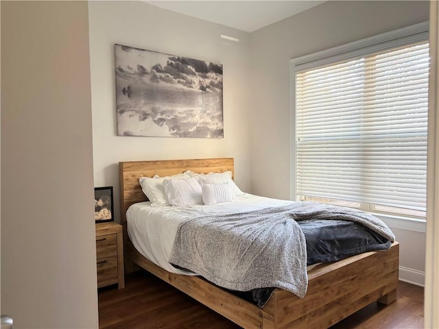 bedroom featuring dark wood-type flooring