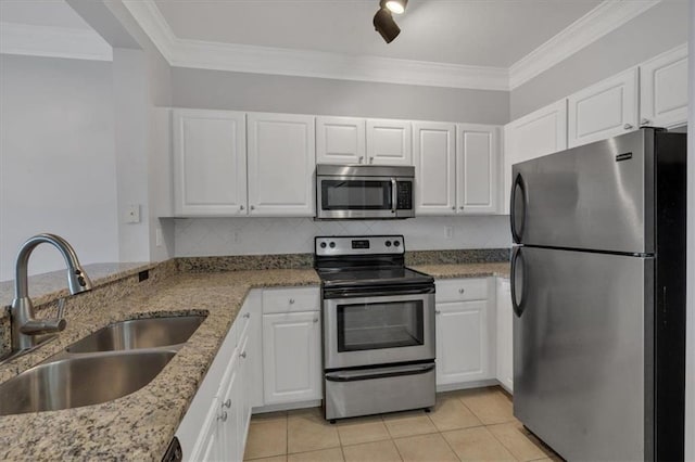 kitchen with tasteful backsplash, stainless steel appliances, ornamental molding, sink, and white cabinetry