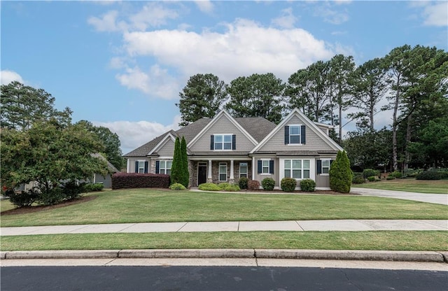 craftsman-style house with a front yard