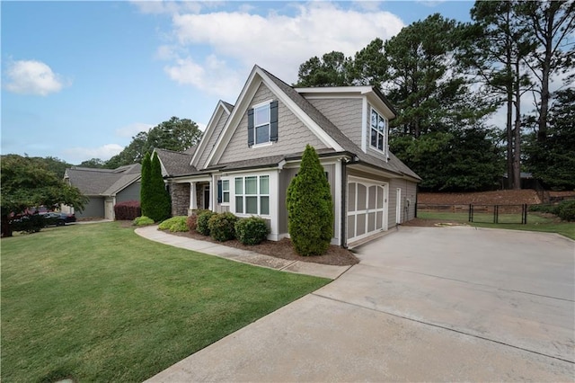 view of front of property with a front lawn and a garage