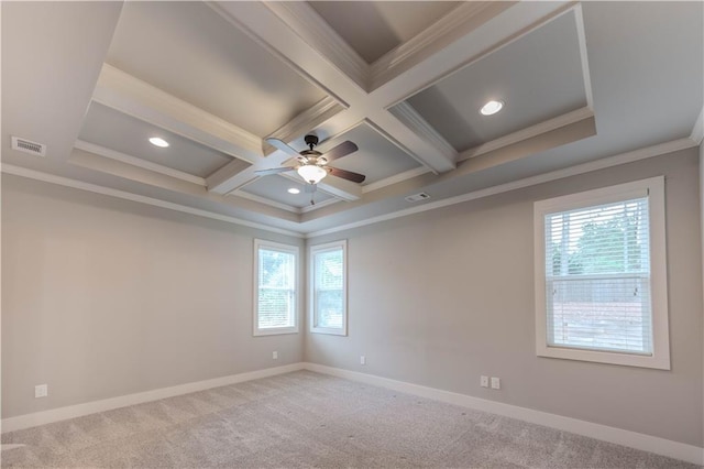 spare room featuring coffered ceiling, crown molding, ceiling fan, beamed ceiling, and light colored carpet