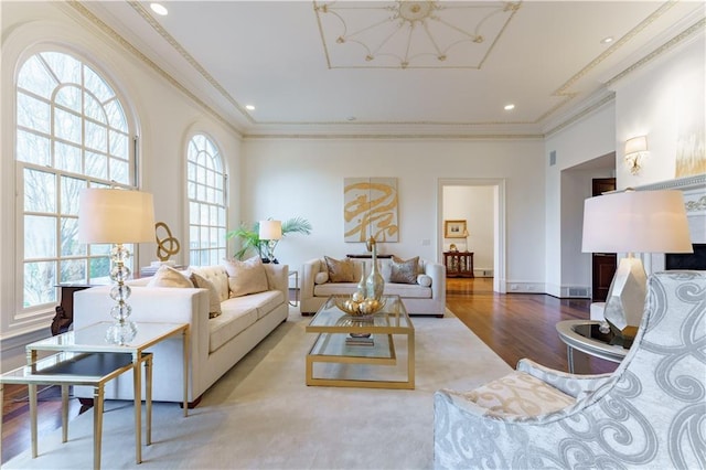 living room with ornamental molding and light wood-type flooring