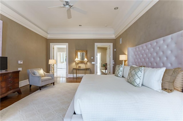 bedroom with crown molding, ceiling fan, and hardwood / wood-style floors