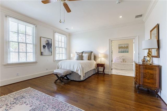 bedroom featuring crown molding, dark wood-type flooring, ensuite bath, and ceiling fan