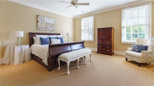 carpeted bedroom with crown molding and ceiling fan