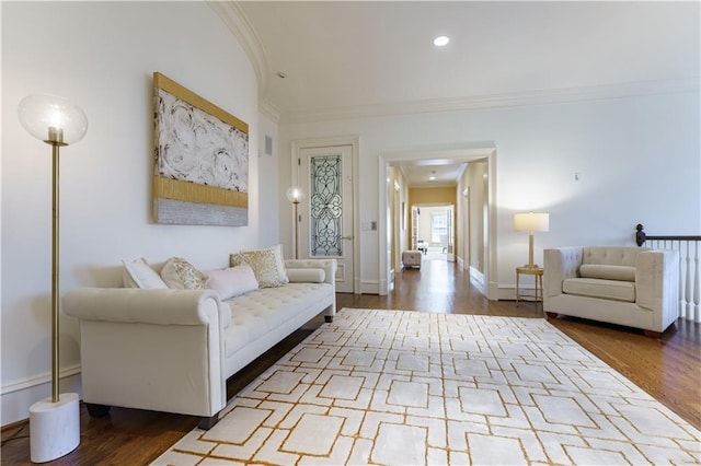 living room featuring ornamental molding and light hardwood / wood-style flooring