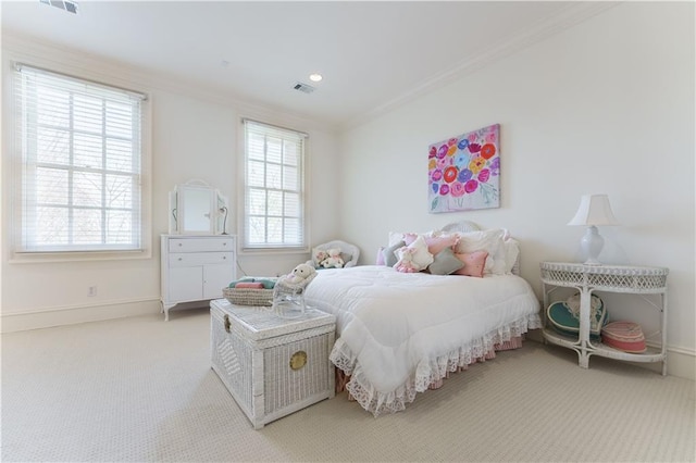 bedroom featuring ornamental molding and carpet