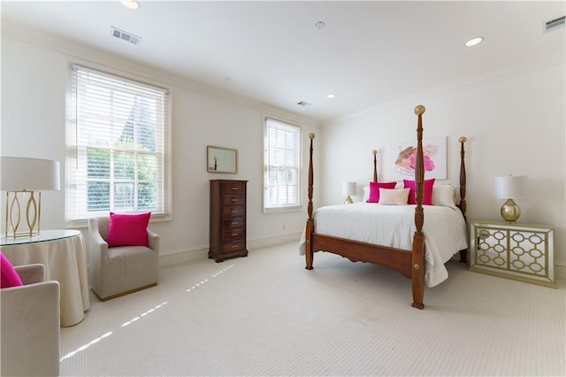 bedroom with ornamental molding and carpet