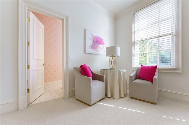 sitting room featuring crown molding and light colored carpet