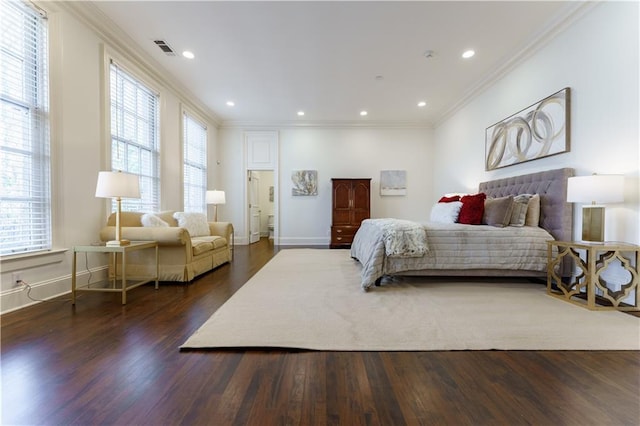 bedroom with dark hardwood / wood-style flooring and crown molding