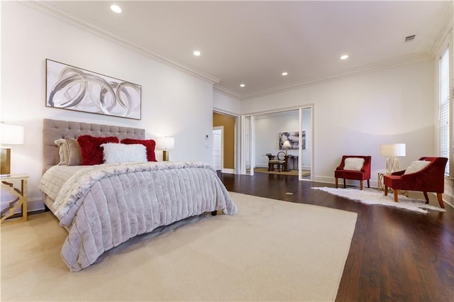 bedroom featuring hardwood / wood-style flooring and ornamental molding