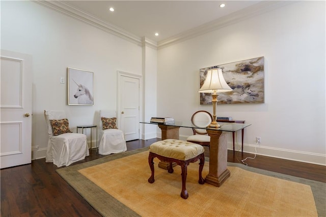 sitting room featuring dark wood-type flooring and ornamental molding