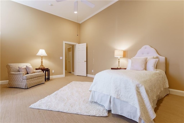 carpeted bedroom with high vaulted ceiling, ornamental molding, and ceiling fan