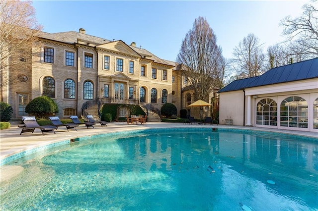 view of pool featuring a patio