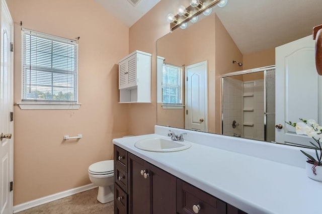 full bath featuring baseboards, a shower with door, toilet, and vanity