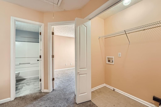 laundry room featuring laundry area, light carpet, baseboards, hookup for a washing machine, and attic access