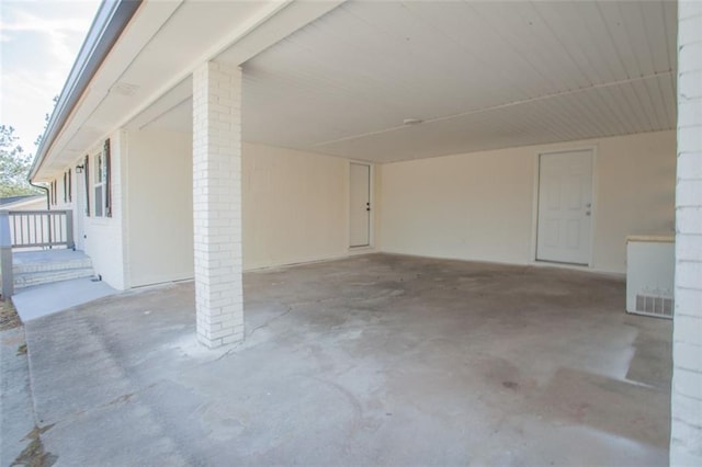 garage featuring a carport