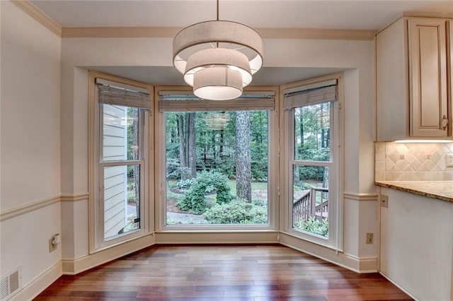 5507 Martina Way, Dunwoody, GA 30338 - unfurnished dining area featuring wood finished floors and baseboards