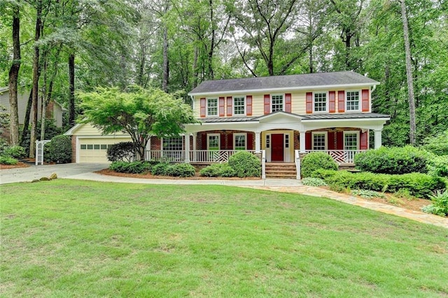 5507 Martina Way, Dunwoody, GA 30338 - colonial house featuring covered porch, driveway, and a front yard